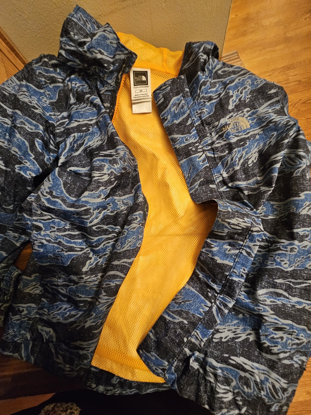 The North Face Kids' Blue Patterned Jacket with Yellow Lining